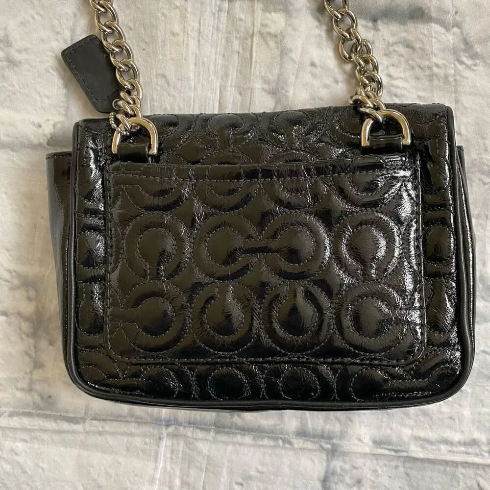 Coach mini shoulder/crossbody bag w/twist latch closure w/satin inner lining